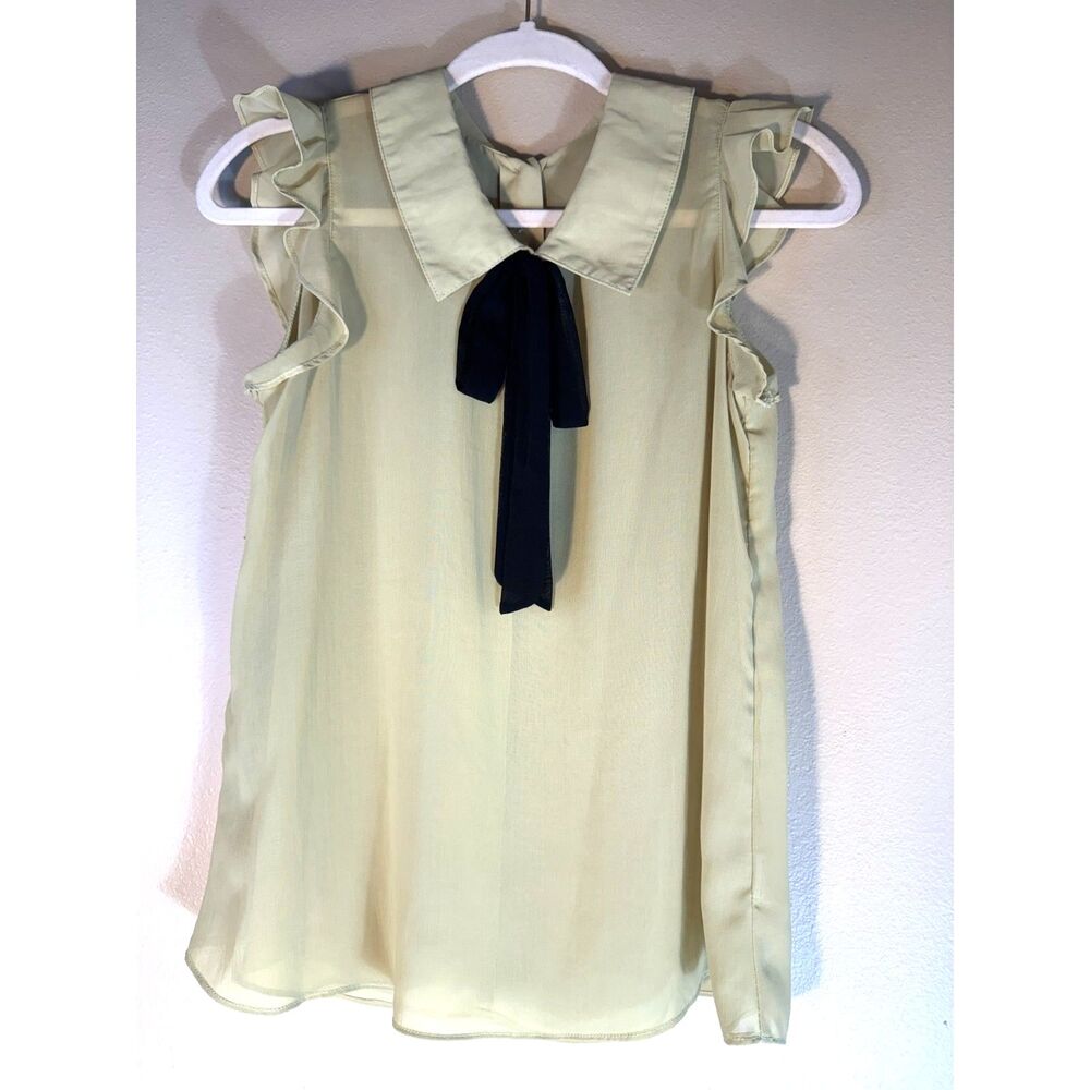 Sheer Light green blouse with black bow